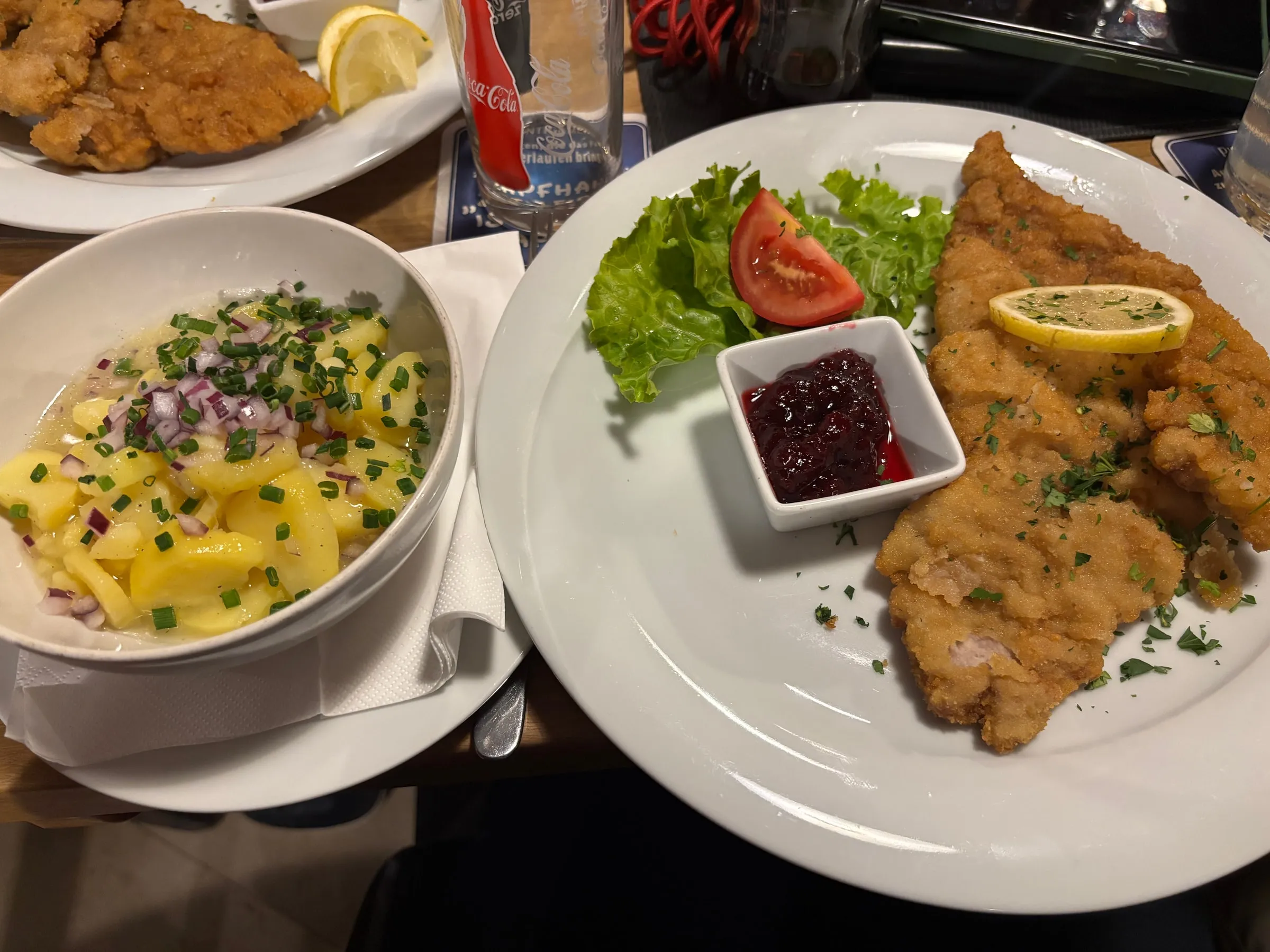 Wiener Schnitzel with lemon, lingonberries and potato salad